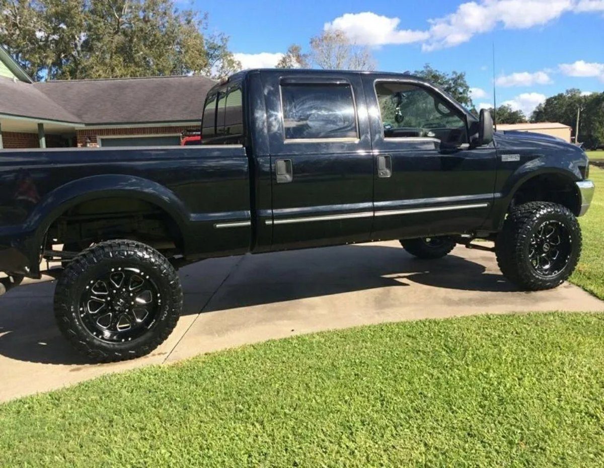 Black Truck in the Front yard parking